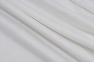 Macro view of premium white breathable fabric texture for women's summer halterneck vest top