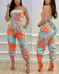 High-resolution detail of the floral print backless jumpsuit with elegant bow tie back