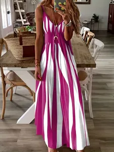 Woman taking a mirror selfie in a casual purple and white striped V-neck maxi dress