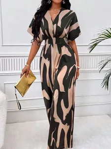 Elegant V-neck batwing sleeve jumpsuit with a bold abstract print and chic wide-leg design
