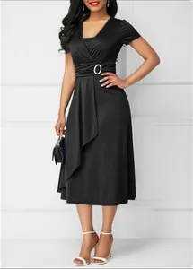 Elegant black V-neck dress featuring a stylish waist buckle and asymmetrical hemline