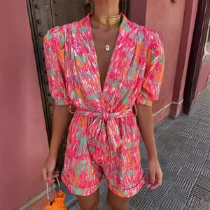 Stylish vibrant pink printed short sleeve V-neck belted romper jumpsuit for casual summer wear