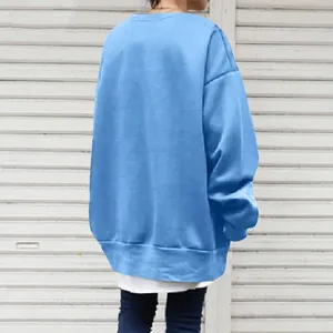 Detailed back view of a light blue oversized crewneck sweatshirt for women with a loose fit