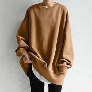 Detail view of a loose fit camel round neck sweatshirt for women with white layer hem