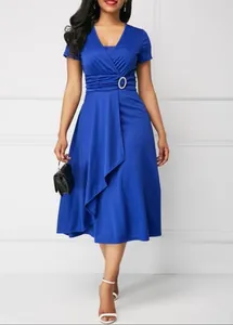 Elegant royal blue V-neck midi dress with asymmetrical flared skirt and rhinestone buckle.