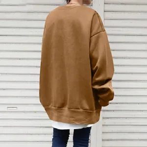 Back view of women's oversized caramel crewneck sweatshirt for a casual street look