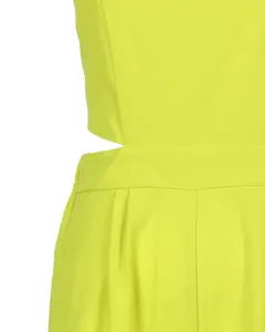 Close-up detail view of neon yellow high-waisted jumpsuit featuring stylish waist cutout design