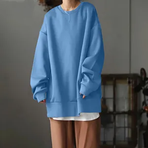 Focus view of a light blue oversized crewneck sweatshirt with dropped shoulder detail