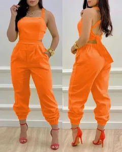 Vibrant orange backless jumpsuit with bow detail and high-waisted elastic cuff pants