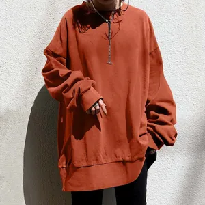 Oversized burnt orange women's sweatshirt with loose fit and round neck detail