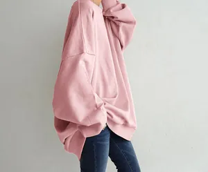 Detailed view of oversized pink crewneck sweatshirt with dropped shoulders and loose fit