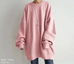 Loose fit oversized pink crewneck sweatshirt featuring drop shoulders and ribbed cuffs