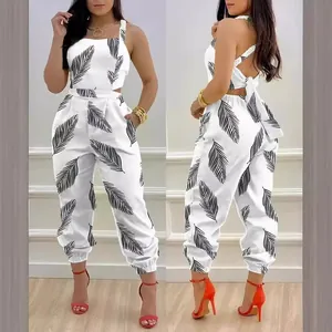 Elegant women's backless jumpsuit featuring black leaf print and bow tie back design