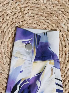 Detailed close-up of a long-sleeved shirt cuff featuring a vibrant 3D digital print.
