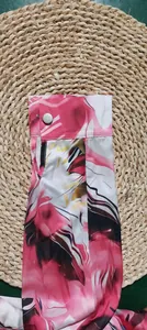 Detailed view of the 3D digital floral print on a long sleeve button-up shirt cuff.
