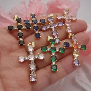 Detailed view of colorful cubic zirconia cross pendants in various vibrant shades.