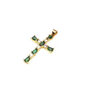 Elegant gold cross pendant featuring green waterdrop zircons and sparkling clear stones