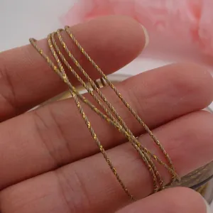 Detailed macro view of 0.8mm gold-twisted cotton cord rope for DIY jewelry craft making.