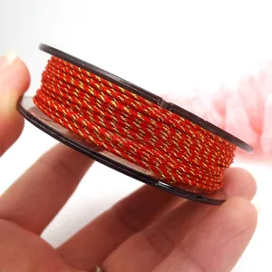 Detailed view of 0.8mm red and gold twisted cotton rope for DIY jewelry and necklaces.