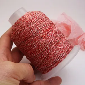 Macro view of a 1.2mm multi-colored hand-rolled cotton thread spool for DIY jewelry