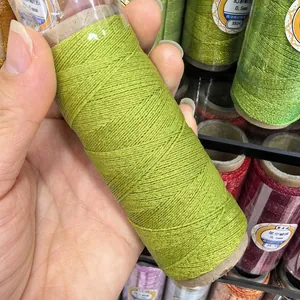 Detail view of 0.4mm metallic green wax cord for DIY jewelry braiding projects