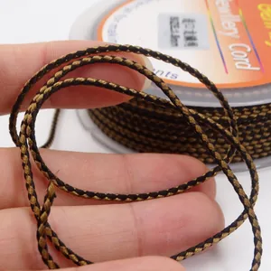 Close-up of 1.5mm black and gold woven dragon pattern jewelry cord texture for DIY crafts