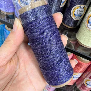 Macro view of purple 0.5mm wax thread with golden glitter on a spool for DIY jewelry