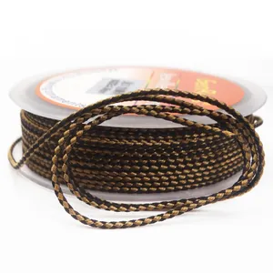 Macro view of 1.5mm black and gold dragon pattern braided cord for DIY jewelry crafts
