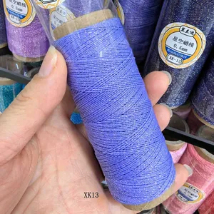 Close-up of 0.5mm purple braided wax thread with gold tinsel for DIY jewelry making