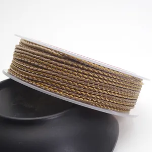 Detail view of 1.5mm gold dragon pattern braided cord for DIY handmade jewelry.