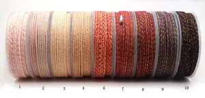 Detailed view of mixed color braided cotton cords with metallic gold threads for DIY jewelry