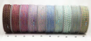 Macro detail of multi-colored cotton ropes with gold metallic threads for DIY jewelry