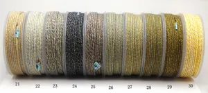 Detailed view of ten spools of metallic mixed cotton jewelry cord with color numbers 21-30.