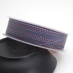 Detailed view of 1.5mm purple and grey braided cord with dragon pattern on spool