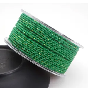 Detail of 1.5mm green Milan cord with interwoven gold metallic thread