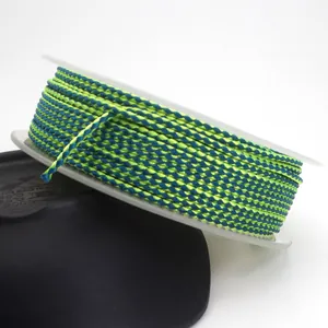 Detailed macro view of 1.5mm braided dragon pattern cord in lime green and blue