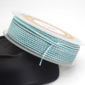 Close-up macro detail of 1.5mm teal and silver braided dragon pattern cord for jewelry DIY