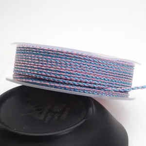 Close-up detail of 1.5mm pink and blue dragon pattern braided cord for DIY jewelry