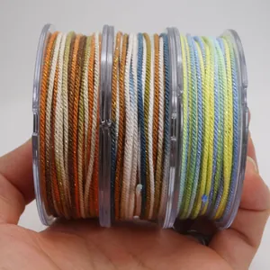 Macro detail of 1.2mm multi-colored cotton cord with metallic gold thread for DIY jewelry