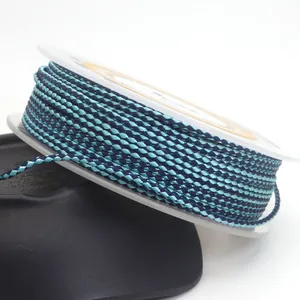 Detailed close-up view of a 1.5mm blue dragon pattern braided cord on a white spool