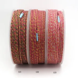 Detailed view of three braided cotton ropes with gold threads, variants 121, 122, and 123