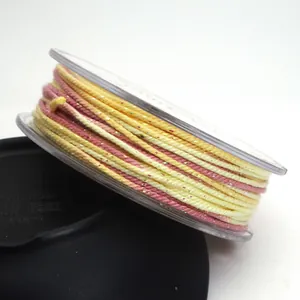 Macro view of 1.2mm metallic gradient cotton cord showing sparkle and texture detail