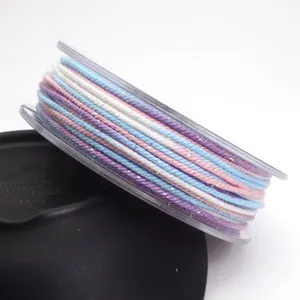 Detail shot showing the texture of 1.2mm colorful braided cotton cord with gold thread