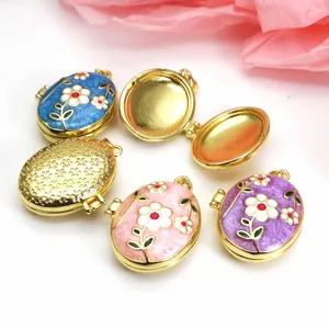 Detailed view of colorful enamel floral locket pendants in gold-plated copper finish.