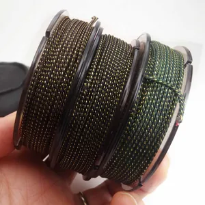Macro view of three spools of gold-threaded braided cords showing texture and color variety