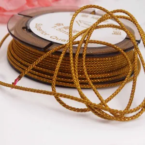 Macro view of 1.5mm golden braided mambo cord for DIY bracelet and necklace weaving