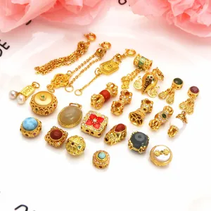 Detailed assortment of sand gold DIY jewelry charms, tassels, and beads for bracelets