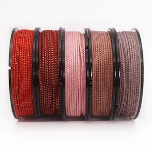Close-up of five rolls of colorful Mambo cords with gold silk threads for DIY jewelry
