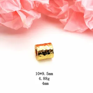 Macro detail of dragon scale gold plated spacer bead with clear size and weight specs.