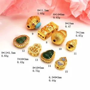 Detailed view of various gold-plated gourd charms and zircon inlaid spacer beads